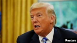 U.S. President Donald Trump speaks during a meeting with the President of FIFA Gianni Infantino in the Oval Office at the White House in Washington, D.C., U.S., Aug. 28, 2018