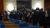 Lawmakers from the opposition MCP walk out of the parliament in protest. (L. Masina/VOA)