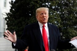 President Donald Trump talks to the media on his way to the Marine One helicopter, Nov. 20, 2019, as he leaves the White House in Washington, en route to Texas.