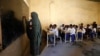 FILE - A teacher conducts a lesson at Banadir zone school in Mogadishu, Somalia, Sept. 22, 2019. 