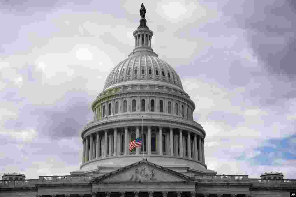 The American flag is lowered to half-staff over the U.S. Capitol, Sept. 8, 2022, on Capitol Hill in Washington, after Queen Elizabeth II, Britain&#39;s longest-reigning monarch and a rock of stability across much of a turbulent century, died after 70 years on the throne.