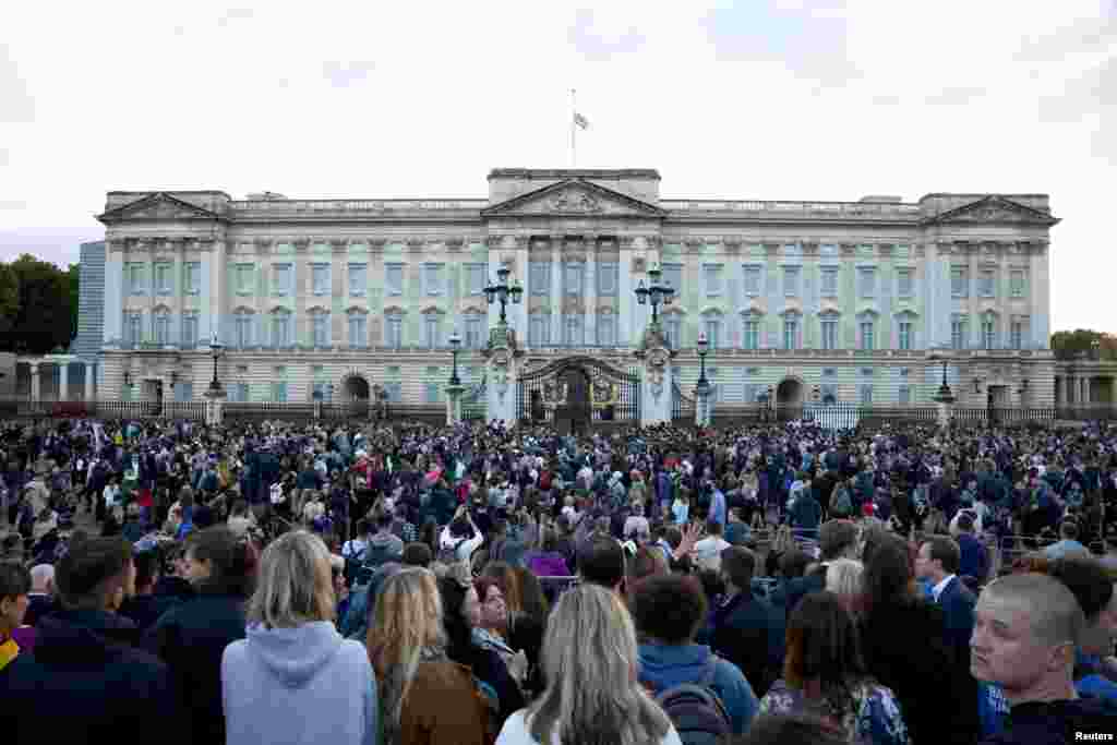 People gather outside the Buckingham Palace in London, after Queen Elizabeth, Britain&#39;s longest-reigning monarch and the nation&#39;s figurehead for seven decades, died, Sept. 8, 2022.