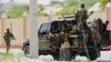 FILE - Somali soldiers are seen riding on a pick-up truck in Mogadishu, Somalia, April 27, 2022. 