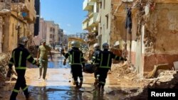 ក្រុមអ្នកជួយសង្គ្រោះចុះប្រតិបត្តិការស្វែងរកមនុស្ស ក្រោយគ្រោះទឹកជំនន់ធ្ងន់ធ្ងរ នៅក្រុង Derna ប្រទេសលីប៊ី ថ្ងៃទី ១៣ ខែកញ្ញា ឆ្នាំ ២០២៣។ 