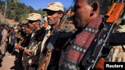 ፎቶ ፋይል፡ በአማራ ክልል ሰሜን ወሎ ዞን ከሚገኙት የቅዱስ ላሊበላ ውቅር አብያተ ክርስቲያን አንዱ በኾነው ቤተ ጊዮርጊስ፣ ጥር 23 /2013 ቅዱስ ጊዮርጊስ በዓል አከባበር የሰልፍ ትዕይንት ሲከናወን ይታያል።/ ሮይተርስ