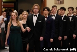 Students of Warsaw's Mikolaj Rej high school dance Poland's national polonaise dance to open their pre-graduation ball in Warsaw, Poland, on Feb. 3, 2024. (AP Photo/Czarek Sokolowski)