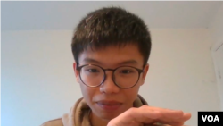 已经解散的香港学生组织“学生动源”前召集人钟翰林在英国时间12月27日晚上到达伦敦并接受美国之音访问 （美国之音郑乐捷）