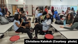 Christiana Kalokoh (middle, left) helps run her school's Bible study club.