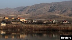FILE - Mountains and a village are seen in the Erzincan province of Turkey, Feb. 7, 2018. A landslide on Feb. 13, 2024, at a gold mine in the province has trapped at least nine workers underground.