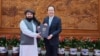 In this photo provided by the Taliban, newly appointed Taliban ambassador Assadullah Bilal Karimi is reportedly presenting his credentials to Hong Lei, director-general of the protocol department at China's Foreign Ministry, in Beijing on Dec. 1, 2023.