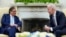 Colombian President Gustavo Petro, left, listens to U.S. President Joe Biden as reporters yell questions in the Oval Office of the White House in Washington, April 20, 2023. (Susan Walsh/AP Photo)