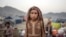 FILE — An Afghan refugee girl stands in a camp near the Torkham Pakistan-Afghanistan border in Torkham, Afghanistan, Nov. 4, 2023.