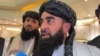 FILE - Zabihullah Mujahid, chief Taliban spokesperson, talks with reporters in Doha, Qatar, June 30, 2024.