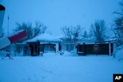 A view of the entrance of the prison colony in the town of Kharp, in the Yamalo-Nenetsk region about 1,900 kilometers northeast of Moscow, Russia, Tuesday, Jan. 23, 2024. (AP Photo, File)