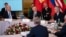 President Joe Biden, Polish President Andrzej Duda and others, listen as NATO Secretary General Jens Stoltenberg speaks during a meeting with the leaders of the Bucharest Nine, a group of countries on the eastern flank of NATO, in Warsaw, Feb. 22, 2023. 