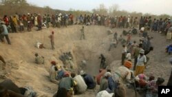 FILE - Miners dig for diamonds in Marange, eastern Zimbabwe, Nov. 1, 2006. 