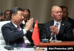 China's President Xi Jinping claps during the BRICS summit , in Johannesburg, South Africa, Wednesday, Aug. 23, 2023. (Alet Pretorius/Pool Photo via AP)