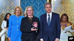 Ukrainian medic Yuliia Paievska receives from first lady Jill Biden and Secretary of State Antony Blinken the International Women of Courage Award at the White House, in Washington D.C., on March 8, 2023. (Manuel Balce Ceneta/AP)