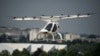 Volocopter 2X, lepas landas dan mendarat vertikal elektrik, melakukan demonstrasi penerbangan pada Paris Air Show di Le Bourget, utara Paris, Prancis, Senin, 19 Juni 2023. (AP/Lewis Joly)