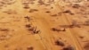 FILE - People arrive at a displacement camp near Dollow, Somalia, Sept. 21, 2022, amid a drought. The United Nations estimates that 1.4 million Somalis have been displaced by current droughts. Somalia's census team will count temporary nomadic settlements using satellite imagery.