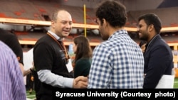 Students interact with industry representatives during a career event at Syracuse University. (Photo courtesy of Syracuse University)