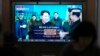 A TV screen shows a report of North Korea's rocket launch with file footage of North Korean leader Kim Jong Un appears during a news program at the Seoul Railway Station in Seoul, South Korea, Aug. 24, 2023. 