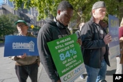 FILE - Activists participate in a rally to call for peer-led, non-police response to mental health crisis calls, Thursday, Sept. 29, 2022, in New York. The Associated Press has found that 14 of the 20 most populous U.S. cities are experimenting with removing police from some nonviolent 911 calls and sending behavioral health clinicians. Initiatives in major cities including New York, Los Angeles, Columbus, Ohio, and Houston had combined annual budgets topping $123 million as of June 2023. (AP Photo/Mary Altaffer)