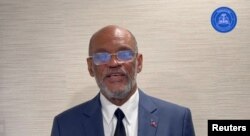 Haiti's Prime Minister Ariel Henry speaks while addressing the nation, at an unidentified location on a date given as March 11, 2024, in this screengrab obtained from a handout video. (Prime Minister of the Republic of Haiti via X/Handout via REUTERS)