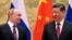 Presiden China Xi Jinping, kanan, dan Presiden Rusia Vladimir Putin berpose untuk foto selama pertemuan mereka di Beijing, China, pada 4 Februari 2022.