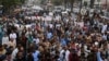 Traders shout slogans during a protest at a street in Karachi, Aug. 23, 2023, against the surge in petrol and electricity prices as Pakistan endures soaring inflation. 
