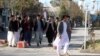 FILE - Male students arrive at the Herat University after the universities were reopened in Herat, Afghanistan, March 6, 2023. 
