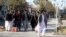FILE - Male students arrive at the Herat University after the universities were reopened in Herat, Afghanistan, March 6, 2023. 
