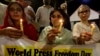 FILE - Pakistani journalists attend a candlelight vigil to observe World Press Freedom Day in Karachi, Pakistan, May 3, 2019. A Karachi-based journalist says violence against journalists has created a sense of numbness among them in 2024.