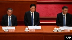 左起：李强、栗战书和习近平在北京人大会堂出席全国政协会议开幕式 (2023年3月4日)