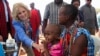 US first lady Jill Biden, meets a traditional Maasai woman and her child at a nutrition outpost within the drought response site, to highlight the impacts of drought relief at the Lositeti village in Matapato North, Kajiado County, Kenya Feb. 26, 2023. 