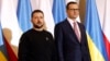 FILE - Poland's Prime Minister Mateusz Morawiecki, right, welcomes Ukrainian President Volodymyr Zelenskyy in Warsaw, April 5, 2023. Morawiecki said on Sept. 20, 2023, that his country was no longer sending new arms to Ukraine.