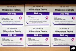 FILE - Boxes of the drug mifepristone sit on a shelf at the West Alabama Women's Center in Tuscaloosa, Ala., on March 16, 2022. . (AP Photo/Allen G. Breed, File)