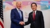 President Joe Biden, left, shakes hands with Japan's Prime Minister Fumio Kishida ahead of a bilateral meeting in Hiroshima, May 18, 2023, ahead of the start of the G-7 Summit.