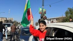 Hilbijartinên Parêzgehên Îraqê, 18 Kanûna Pêşîn 2023, zarokek tevî alayê Kurdan li bajarê Kerkuk