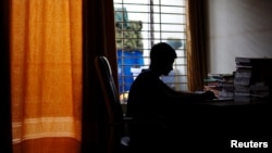 Sheikh Tamim Hasan, 13, a student of class seven, studies in his room as authorities decided to close schools during countrywide heatwave in Dhaka, Bangladesh, April 30, 2024. (REUTERS/Mohammad Ponir Hossain)