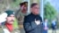 In this handout picture taken and released by Pakistan Prime Minister's Office on March 4, 2024, Pakistan's newly sworn-in Prime Minister Shehbaz Sharif, right, inspects the guard of honor at the Prime Minister House in Islamabad. 