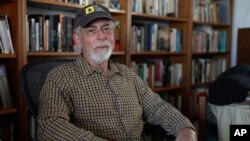 Journalist Gustavo Gorriti poses for a portrait at his home in Lima, Peru, April 26, 2024. 