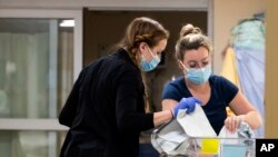 Nurses care for newborns at the University of Vermont Children’s Hospital in Burlington, Vermont, April 28, 2023. Research found that babies born to opioid users had shorter hospital stays when their care emphasized parent involvement.