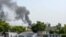 Smoke rises following an explosion after suicide squad allegedly attempted to storm an army cantonment that houses military residences and offices in Bannu on July 15, 2024.