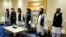 FILE - Members of the Taliban's peace negotiation team attend a meeting amid talks between Taliban and the Afghan government, in Doha, Nov. 21, 2020. Taliban says it will send a delegation to the two-day United Nations conference on Afghanistan, scheduled in Doha, June 30.
