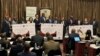 Checks totaling about $32 million are presented from African Risk Capacity to Zimbabwe for drought recovery, in Harare on July 4, 2024. 