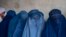 FILE - Afghan women wait to receive food rations distributed by a humanitarian aid group, in Kabul, Afghanistan, May 23, 2023. The Taliban were adamant on June 29, 2024, that they would not discuss women's rights in Afghanistan at a two-day U.N. meeting in Doha, Qatar.