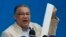 Former presidential candidate Enrique Marquez of the Centrados Party holds an election results tally sheet during a press conference about the disputed presidential election in Caracas, Venezuela, Aug. 14, 2024.