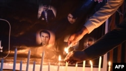 FILE - Pakistanis light candles for journalists killed in a targeted suicide bombing, to mark World Press Freedom Day, in Quetta on May 3, 2018. Media freedom advocates are expressing outrage this week, as Pakistan recorded its eighth journalist killing so far in 2024.