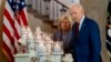 President Joe Biden, with first lady Jill Biden, looks at flowers and candles with the names of victims as he arrives to speak on the one-year anniversary of the school shooting in Uvalde, Texas, at the White House in Washington, May 24, 2023.